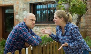 Neighbors dispute yard - ALTA SURVEY Ohio A licensed surveyor marking property boundaries during a property line survey