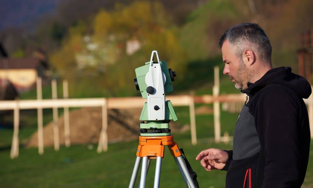  Land surveyor performing a boundary survey in a Cleveland residential neighborhood