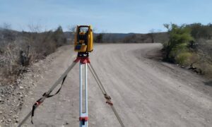 Surveying equipment set up on a rural site in Ohio to conduct a topographic survey, capturing elevation and land features before construction planning.
