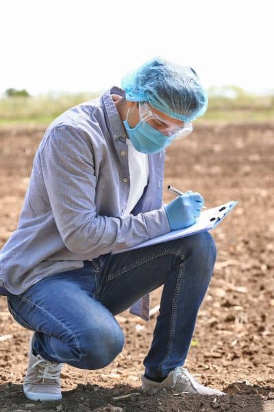 Soil scientist recording results during a soil and site evaluation as alternative to perc test
