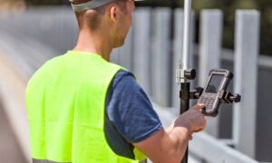 A field technician uses modern surveying equipment to collect data that supports an accurate property survey