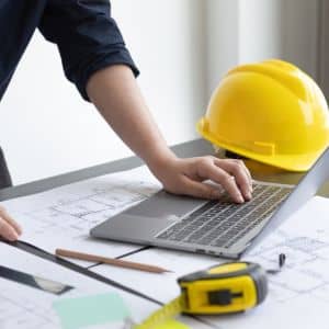 Engineer reviewing project plans and data handoff on laptop - ALTA SURVEY Ohio Engineer reviewing project plans and deliverables on a laptop to confirm lidar data handoff and file requirements