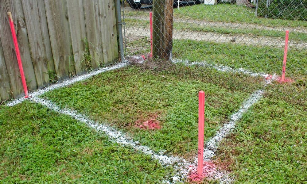 Residential boundary markers near fence - ALTA SURVEY Ohio Property line survey showing boundary markers and painted lines near a residential fence