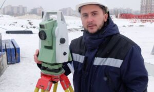 Winter commercial land surveyor site work - ALTA SURVEY Ohio Commercial land surveyor conducting a winter site survey that helps determine accurate ALTA survey cost for commercial properties