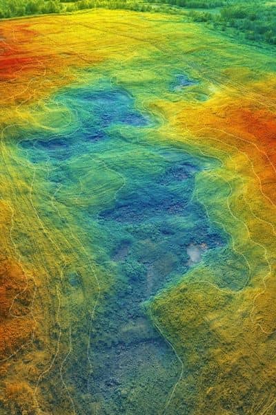 Color-coded elevation map showing subtle terrain changes and water flow patterns identified through lidar mapping