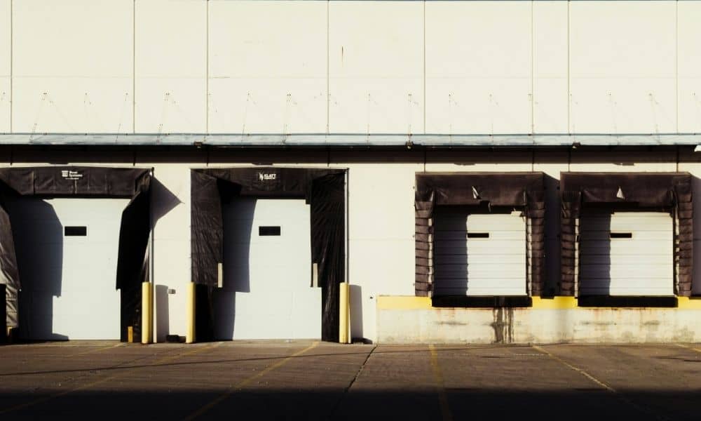 Row of loading docks at an operating industrial warehouse, illustrating site conditions reviewed in an ALTA survey for a Cleveland sale-leaseback