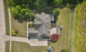 Loan closing survey private sewer easement - ALTA SURVEY Ohio Aerial view of a residential property with a house, driveway, and yard, showing the site details a loan closing survey may document