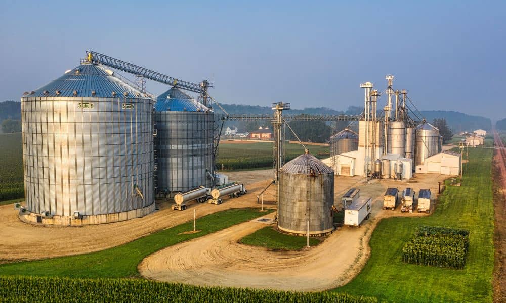 Aerial view of a rail-served food production facility during a due diligence survey, with rail cars, storage silos, and processing infrastructure visible